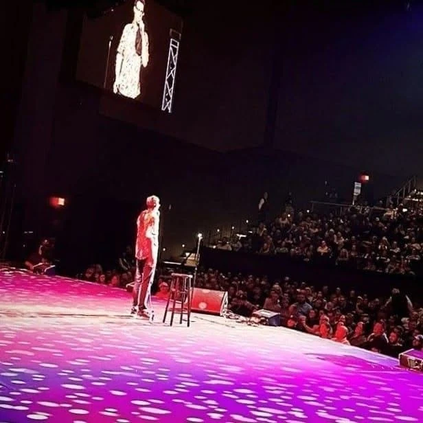 Brandon Killough performing in a theater